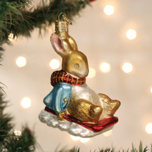 Load image into Gallery viewer, Peter Rabbit On Sled Ornament
